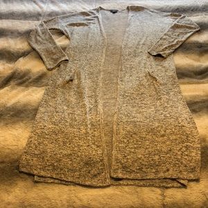 Long shawl with slit in the side and fake pockets